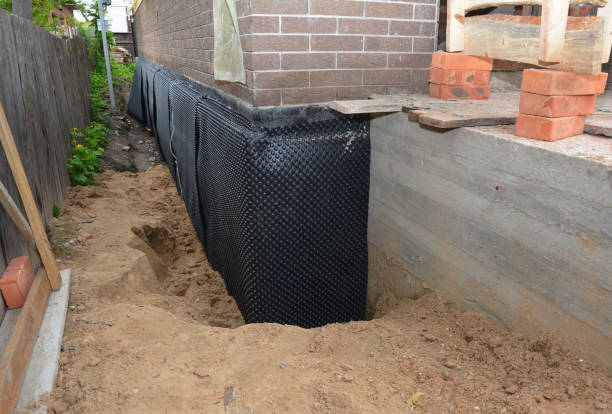 Happy homeowners after waterproofing job in Alto